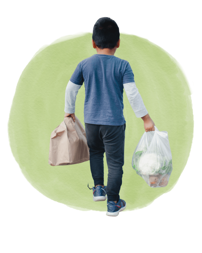 Smiling woman giving a piggyback ride to a laughing young girl.
